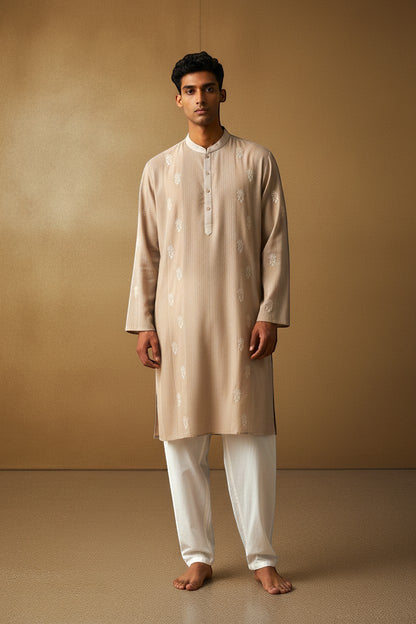 Orly beige cotton blend kurta with white hand embroidered motifs and subtle texture, ideal for festive occasions.