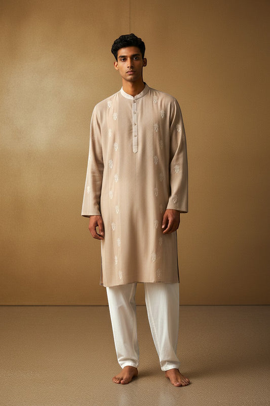 Orly beige cotton blend kurta with white hand embroidered motifs and subtle texture, ideal for festive occasions.