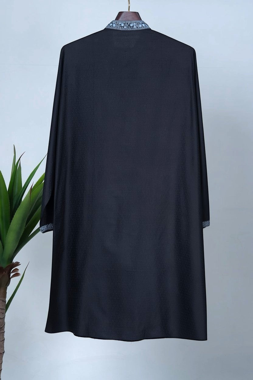 Orly black floral hand-embroidered kurta with blue-toned detailing on placket and cuffs. Lightweight fabric with woven texture.