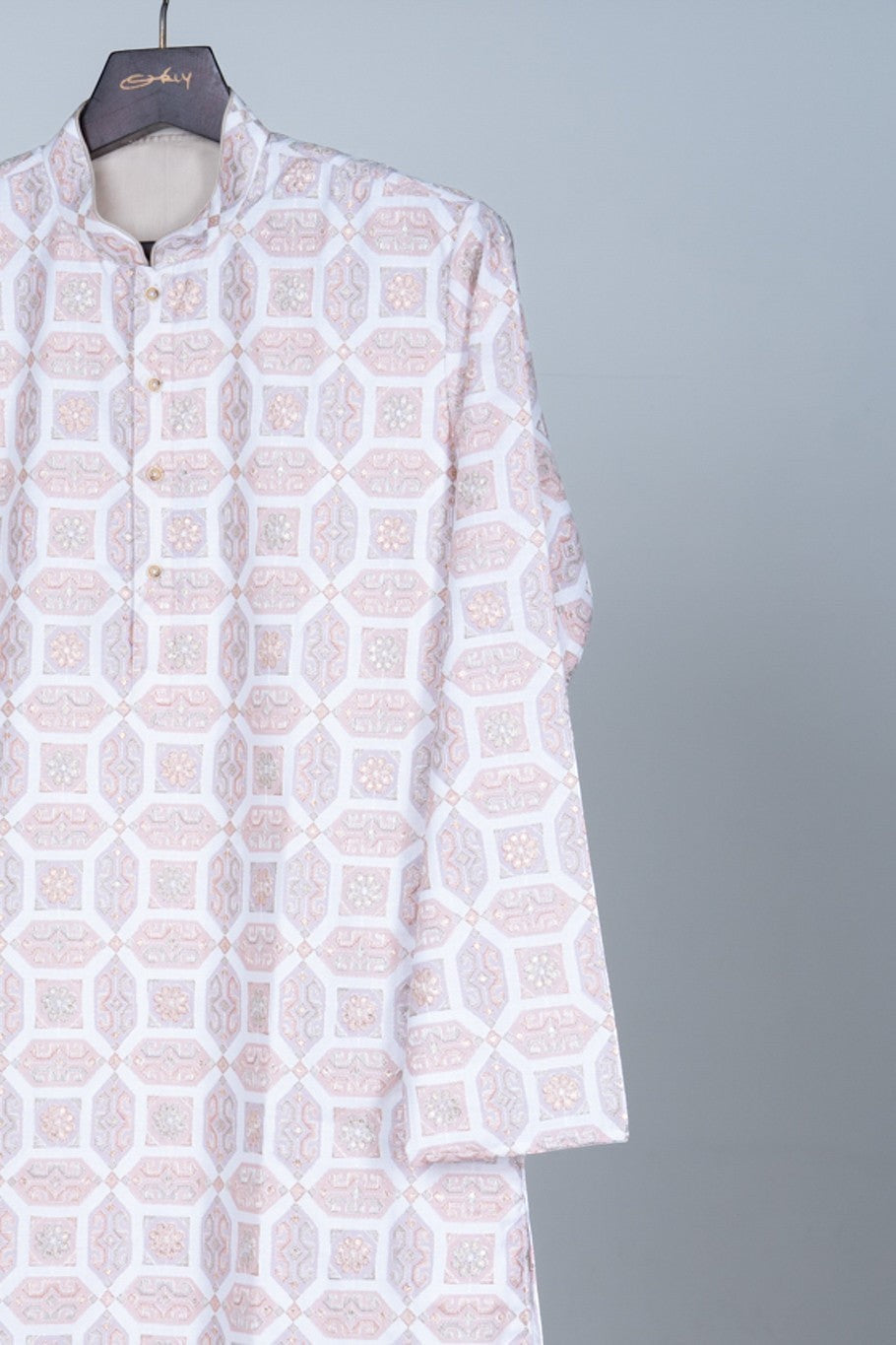 Orly blush geometric jacquard kurta with zari-style embroidery and sequin accents. Band collar, tonal placket. Formal festive wear.