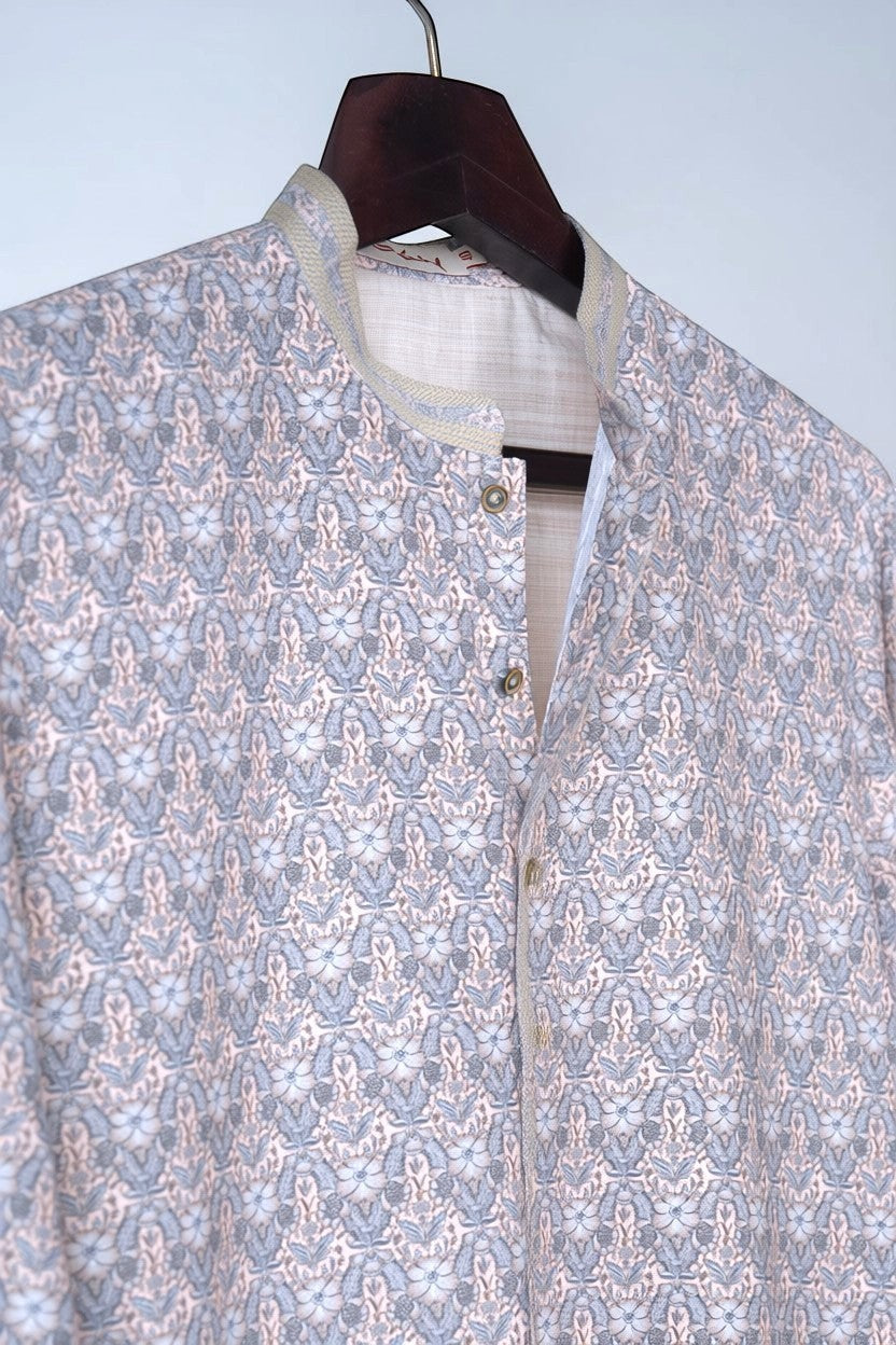 Orly mist pink kurta with all-over floral print and subtle sequin highlights. Mandarin collar with contrast detailing.