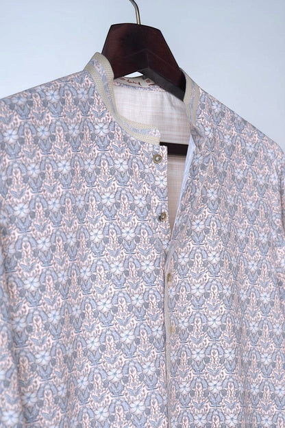 Orly mist pink kurta with all-over floral print and subtle sequin highlights. Mandarin collar with contrast detailing.