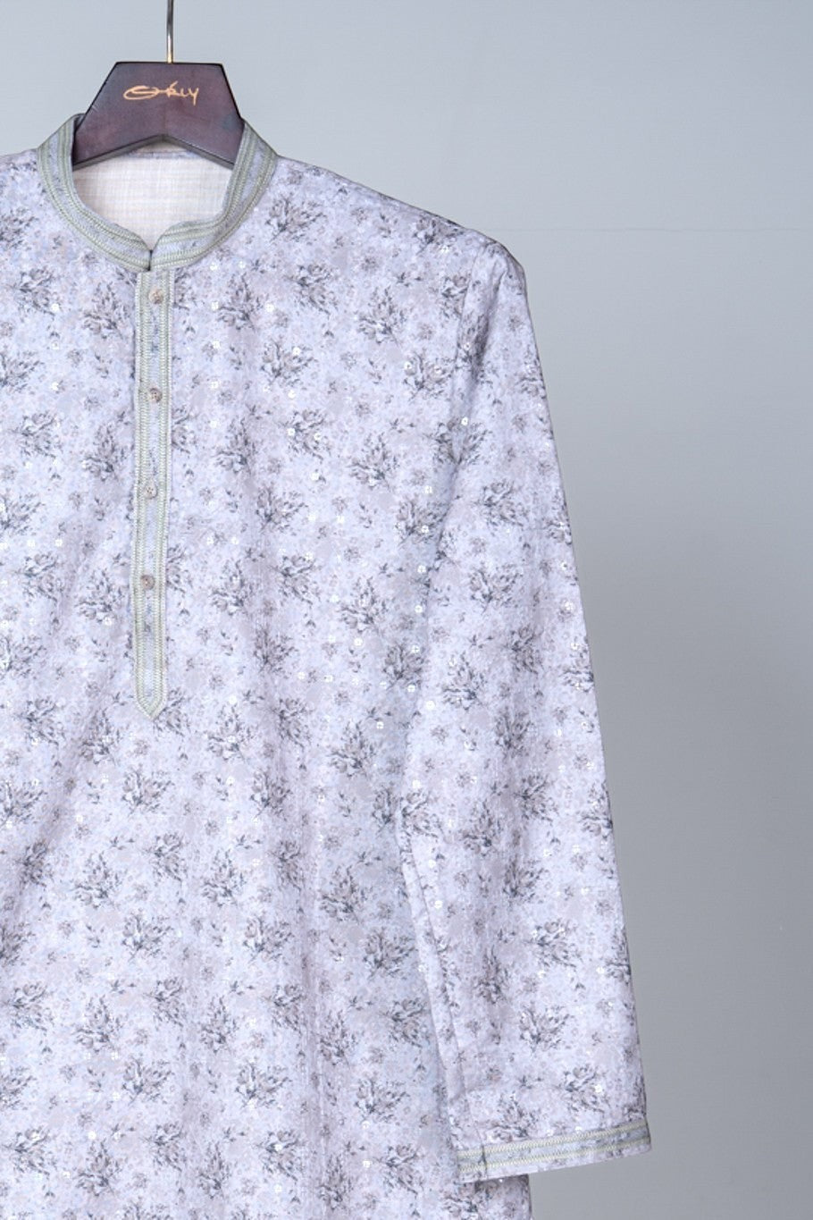 Orly pastel mint green kurta with all-over floral print and sequin accents. Features textured contrast detailing.
