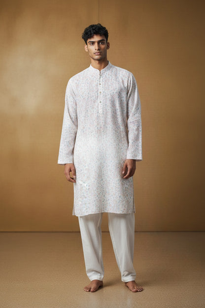 Orly powder blue kurta with pink paisley and floral print, sequin accents, and contrast placket. Paired with off-white pyjama.