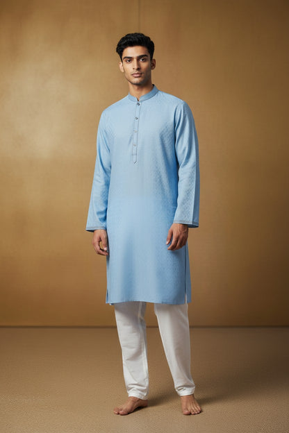 Orly sky blue jacquard kurta with subtle vine motifs, band collar, and contrast placket. Ideal for summer festivities.