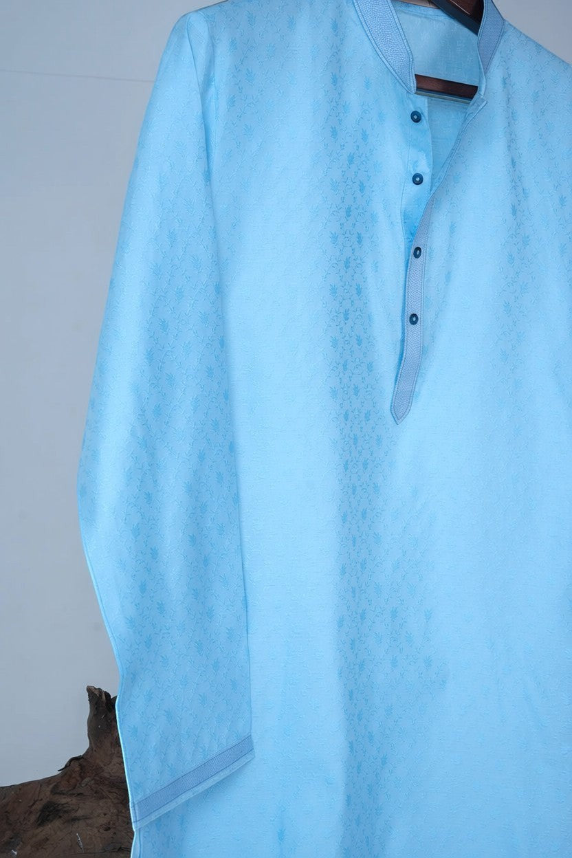 Orly sky blue jacquard kurta with subtle vine motifs, band collar, and contrast placket. Ideal for summer festivities.