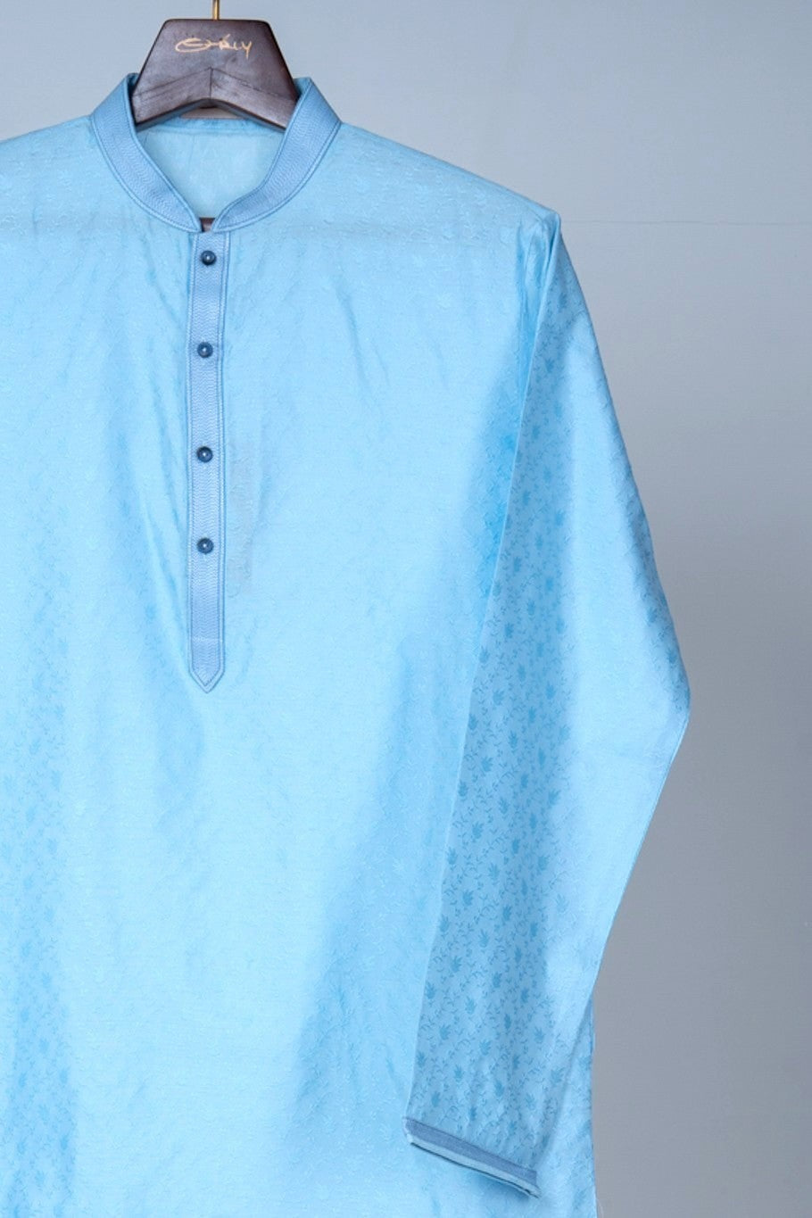 Orly sky blue jacquard kurta with band collar and subtle vine motifs. Ideal for summer festivities.